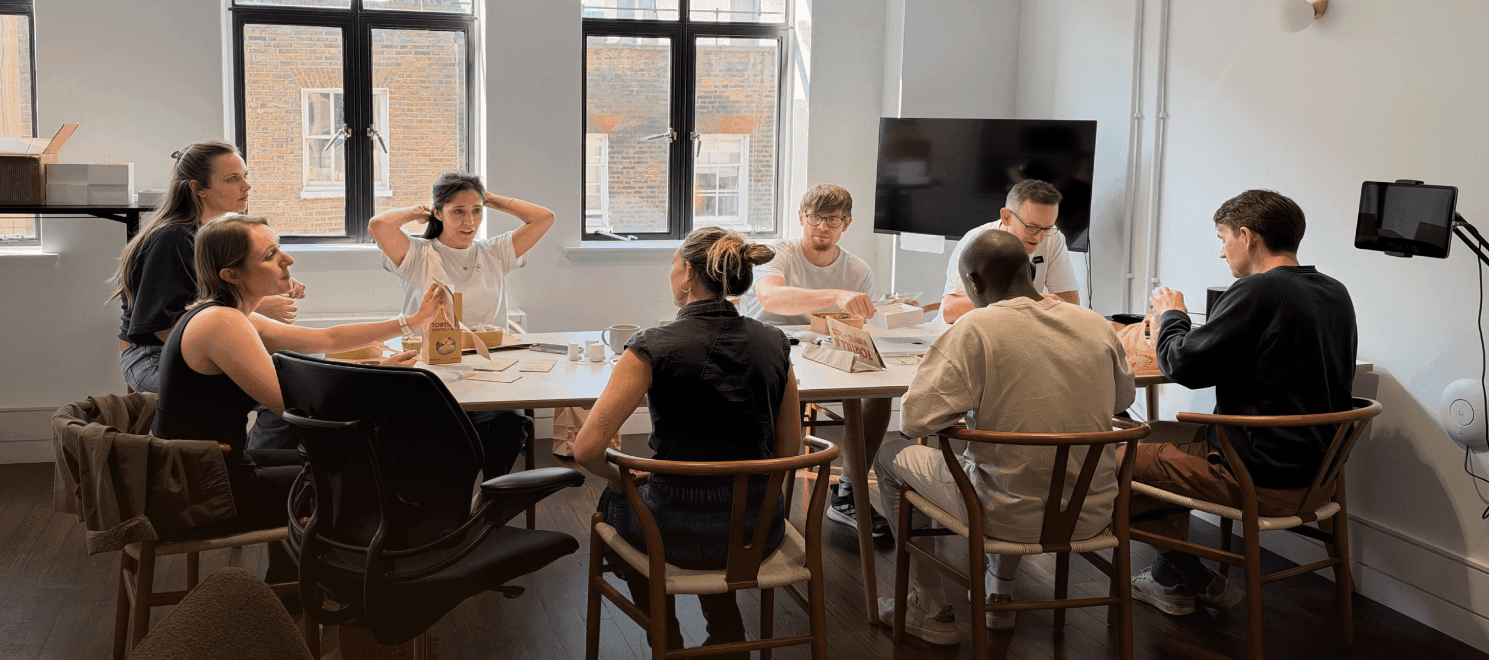 The Rokk team around a table in the studio